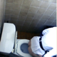 A daring cameraman peers over a public restroom stall wall and video records a Korean woman taking a shit into a toilet. Plop sounds and some poop action is visible from above. Over a minute.
